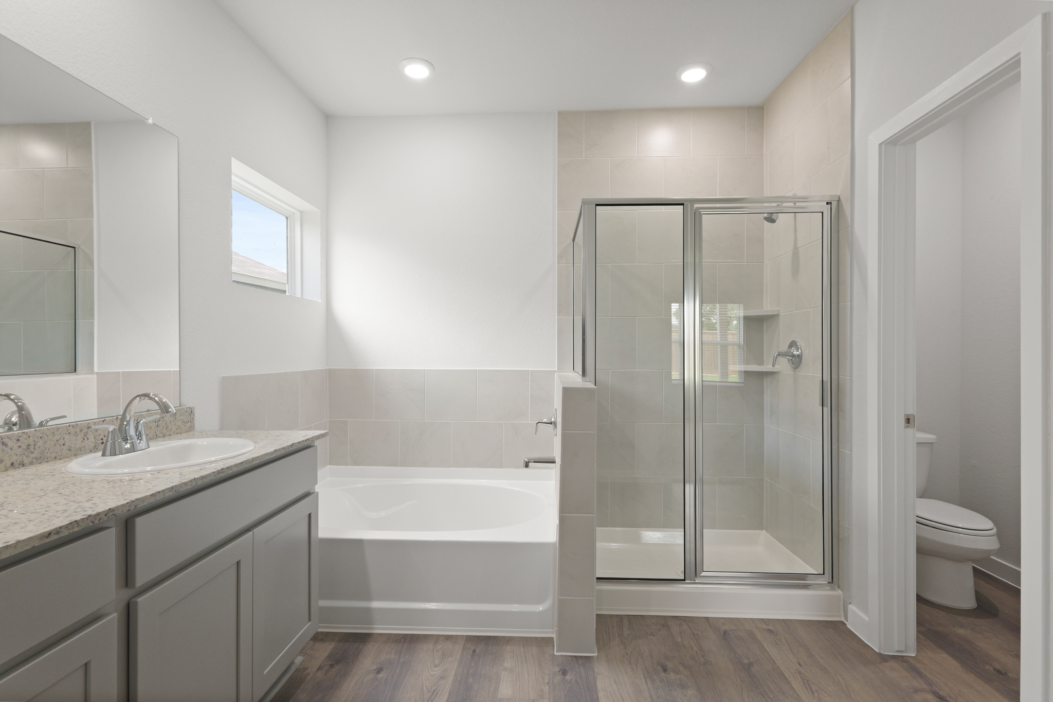 A bathroom with a glass shower.