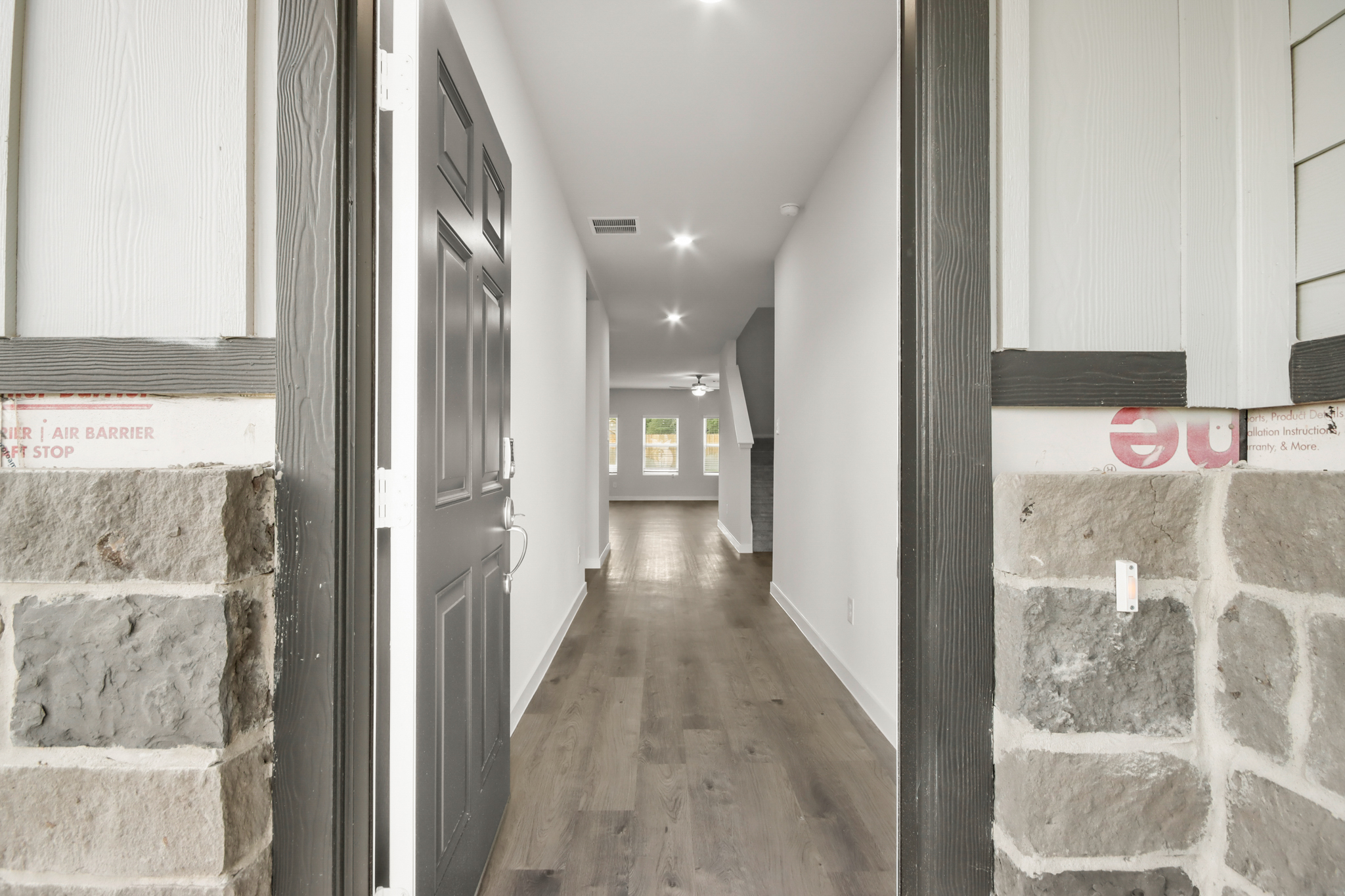 A hallway with signs on the wall.