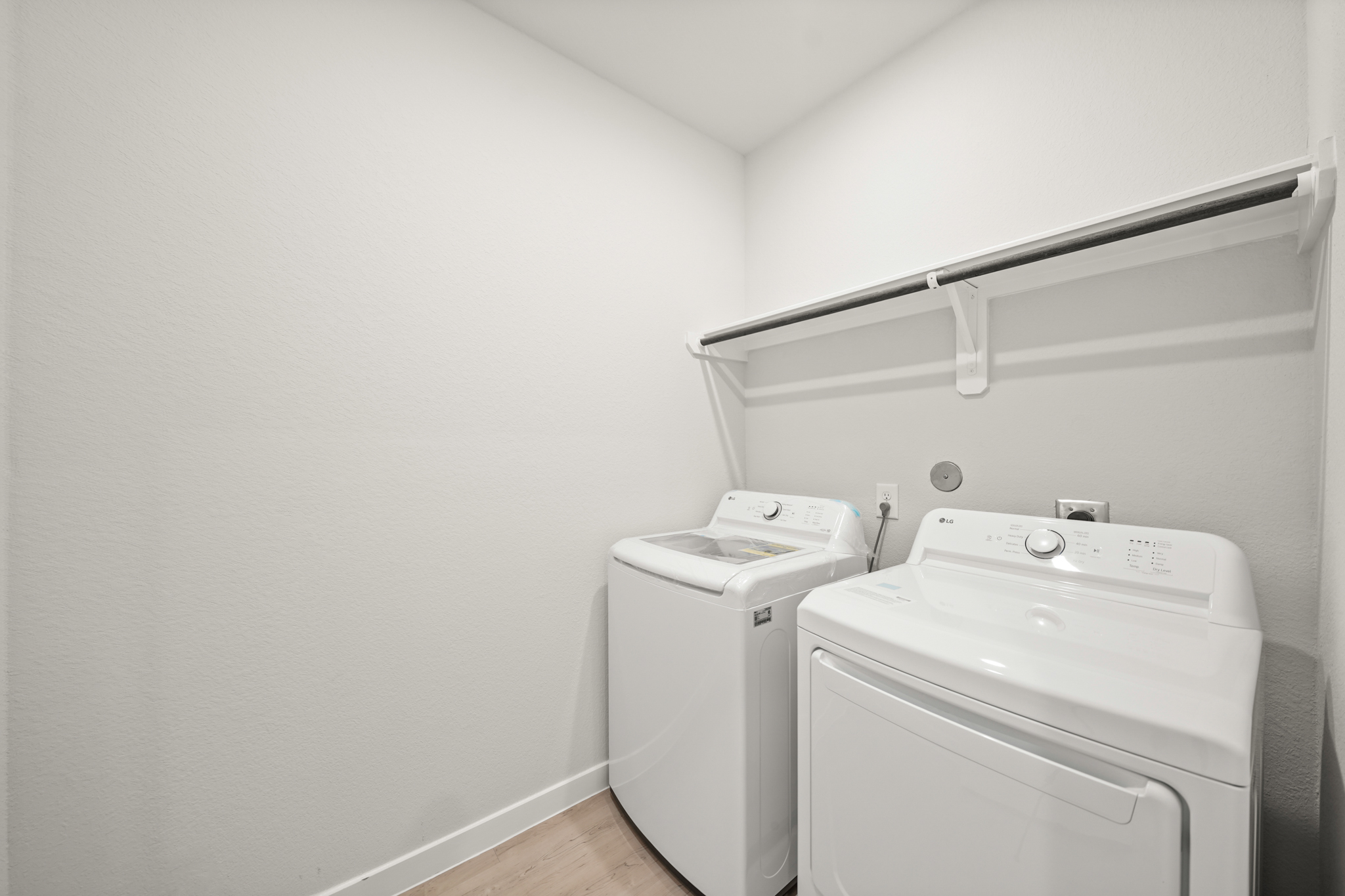 A washing machine in a room.