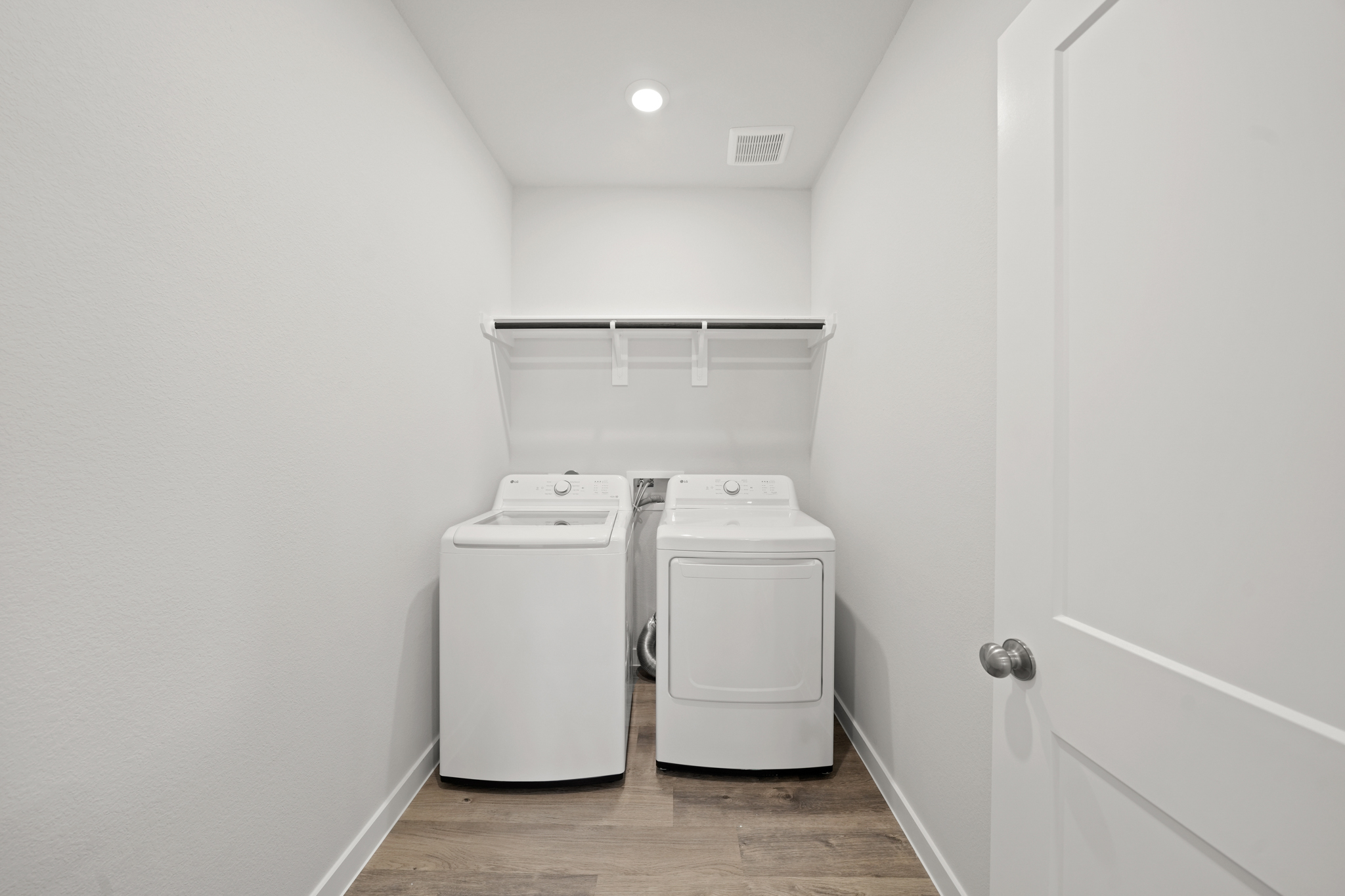 A laundry room with a washer and dryer.