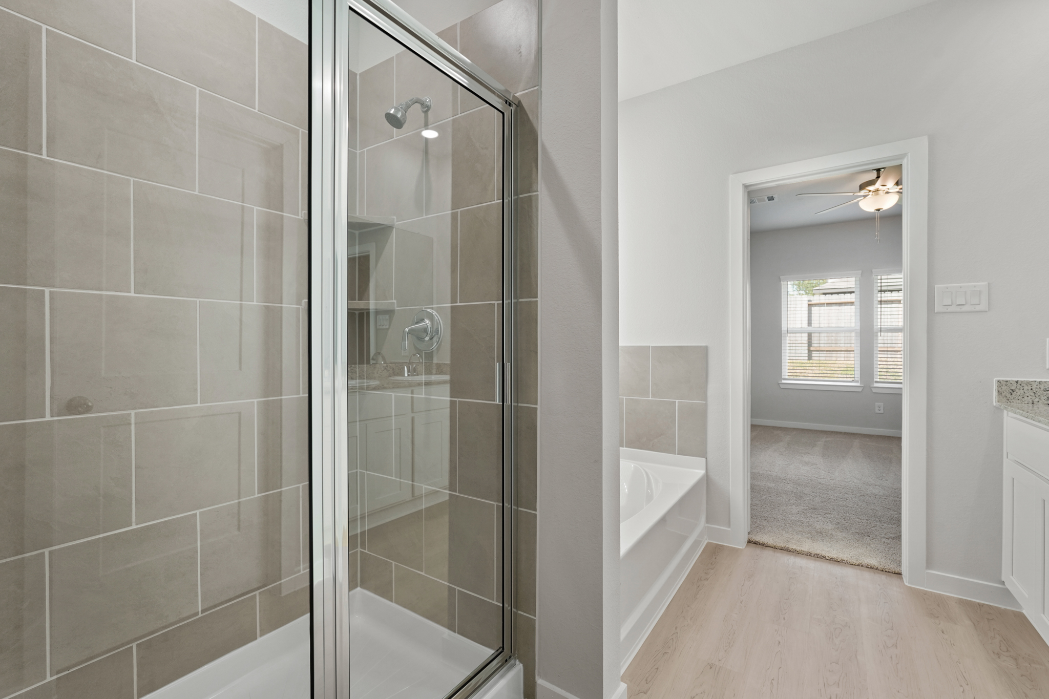 A bathroom with a glass shower.