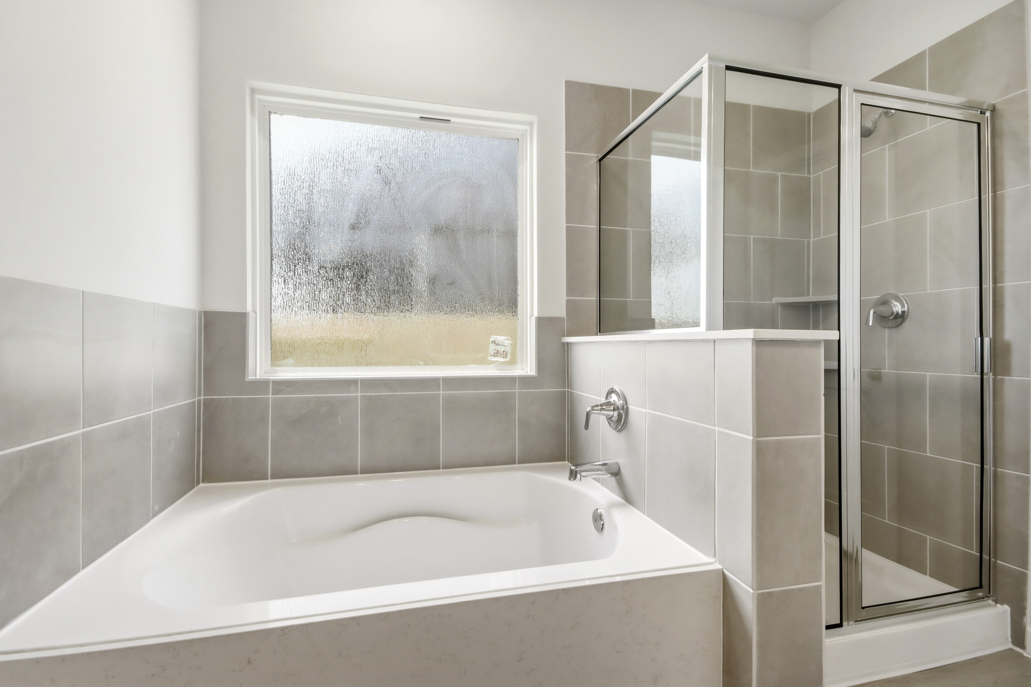 A bathroom with a glass shower.