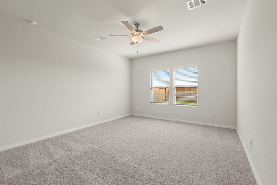 A room with a ceiling fan and a ceiling fan.