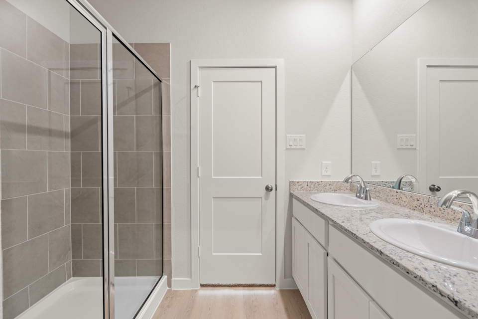 A bathroom with a glass shower.
