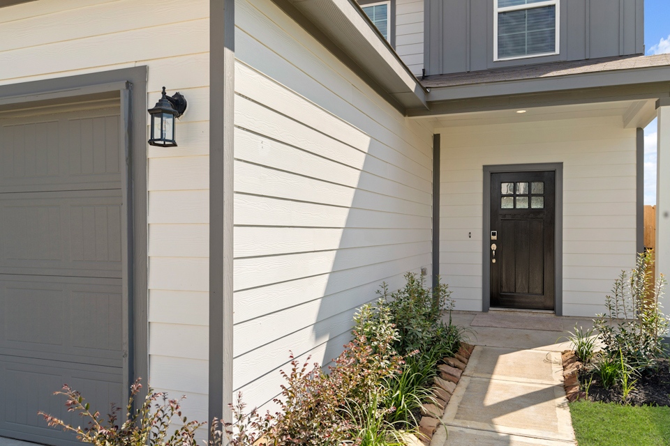 A house with a light on the side.