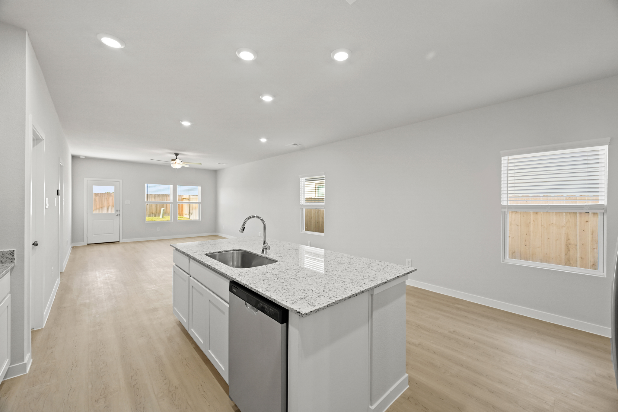 A kitchen with a marble countertop.