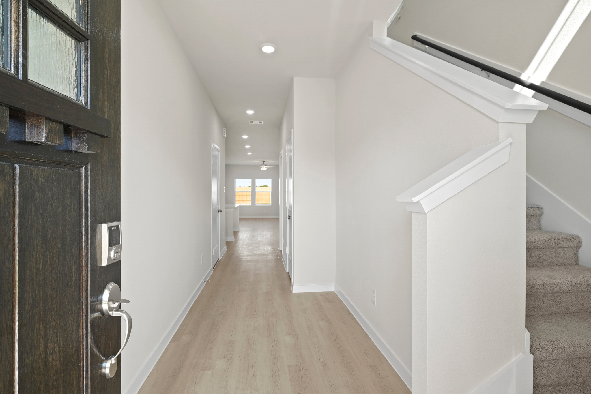 A hallway with white walls.