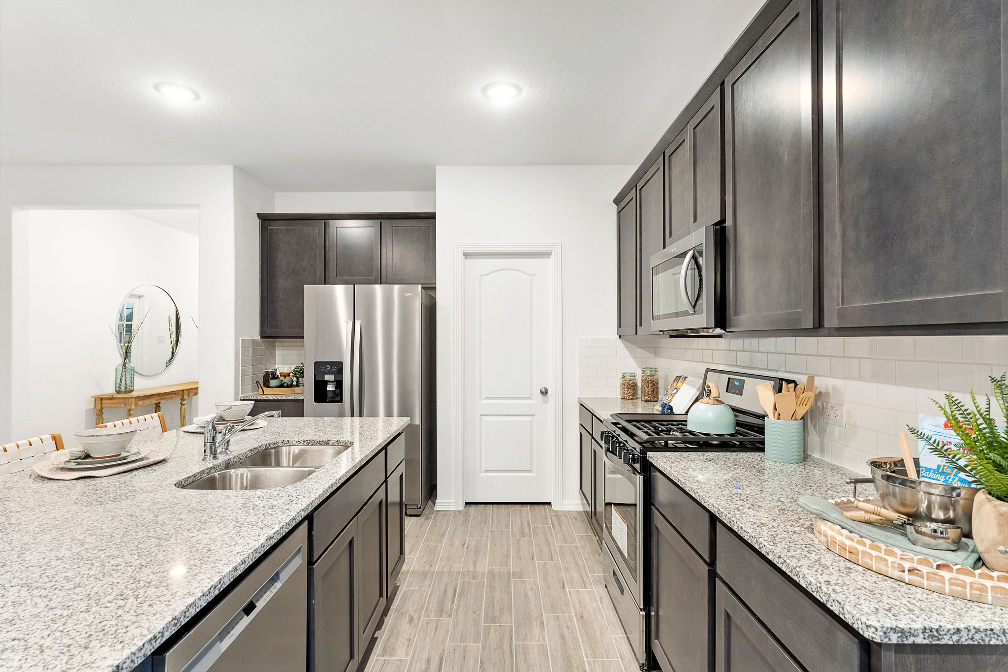 A kitchen with black cabinets.