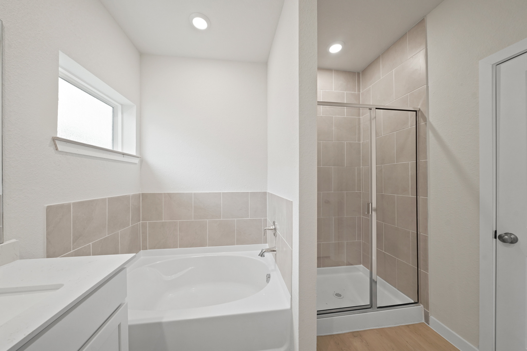 A bathroom with a glass shower.