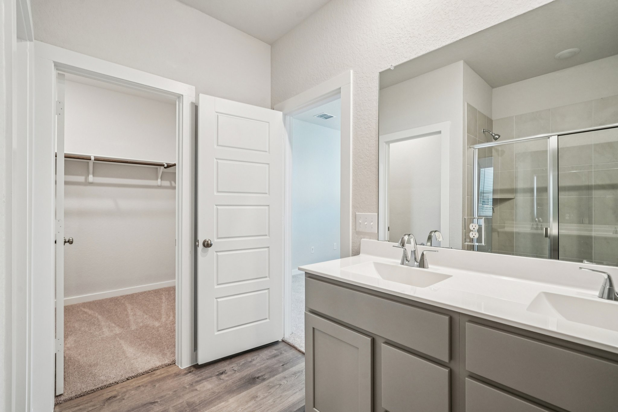 A bathroom with a glass shower.