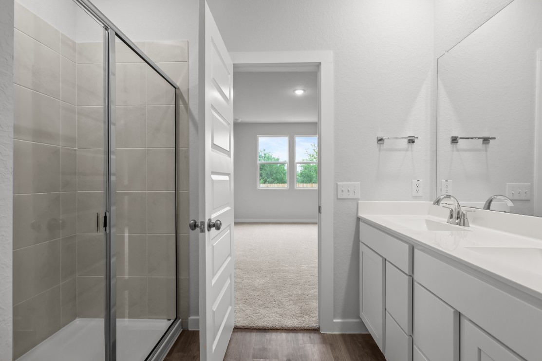 A bathroom with a glass shower.