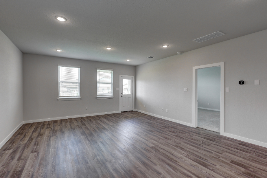 A room with a wood floor and a wood floor.