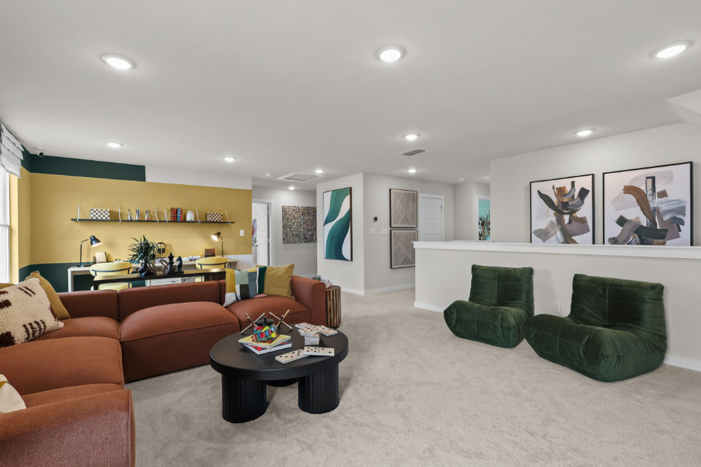 A living room with green couches.