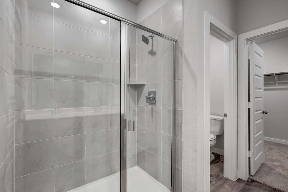 A bathroom with a glass shower.