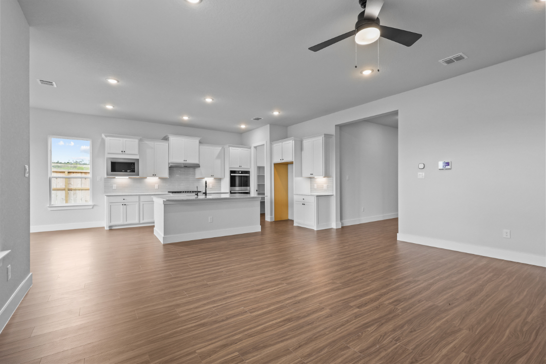 A large kitchen with white cabinets.