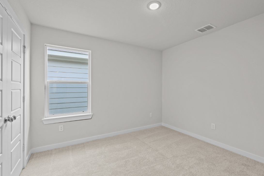 A room with a door and a window.