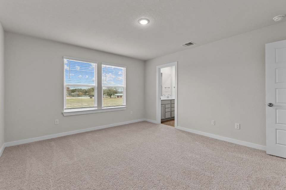 A room with a window and a door.