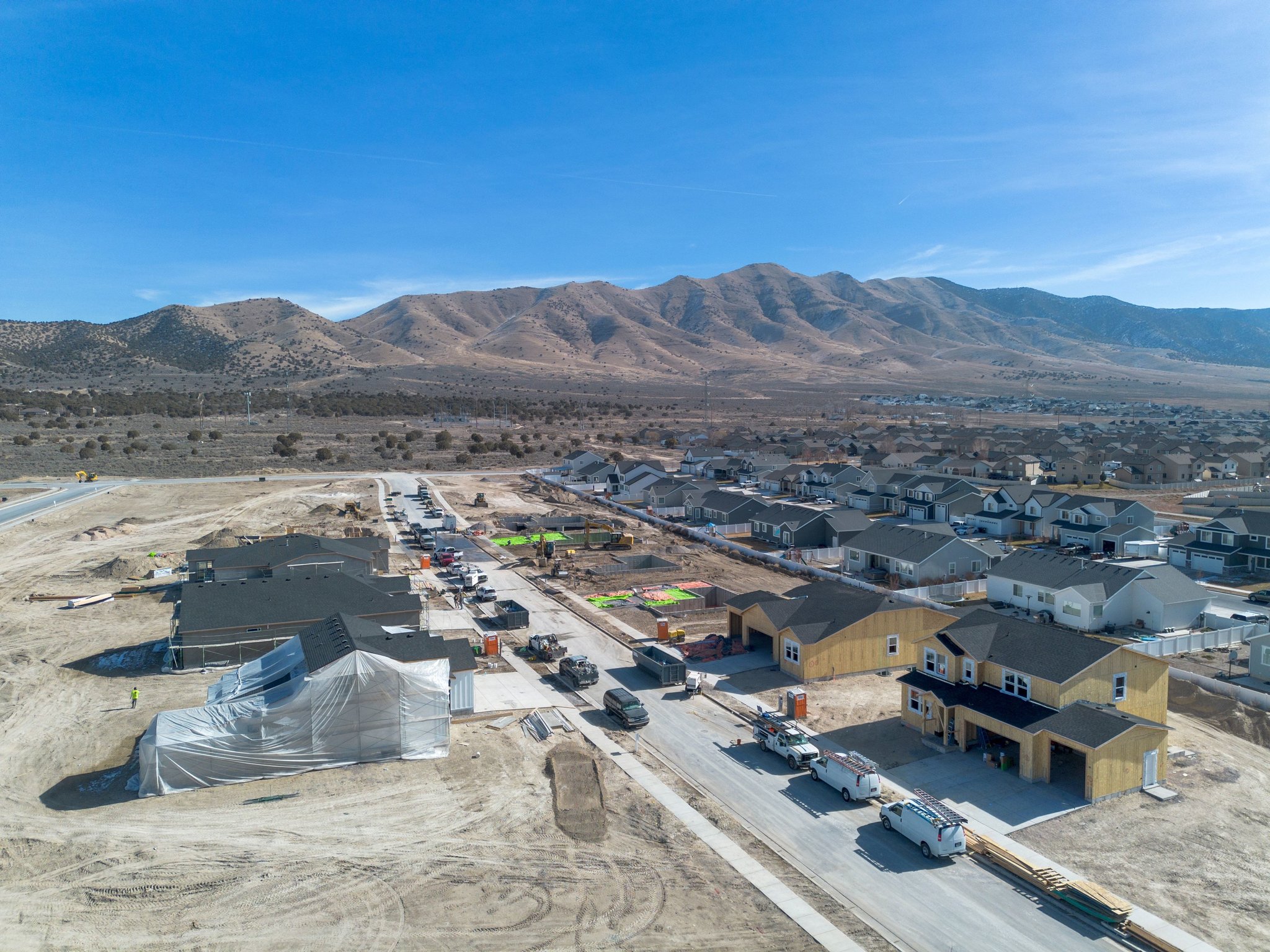 A large area with buildings and cars.