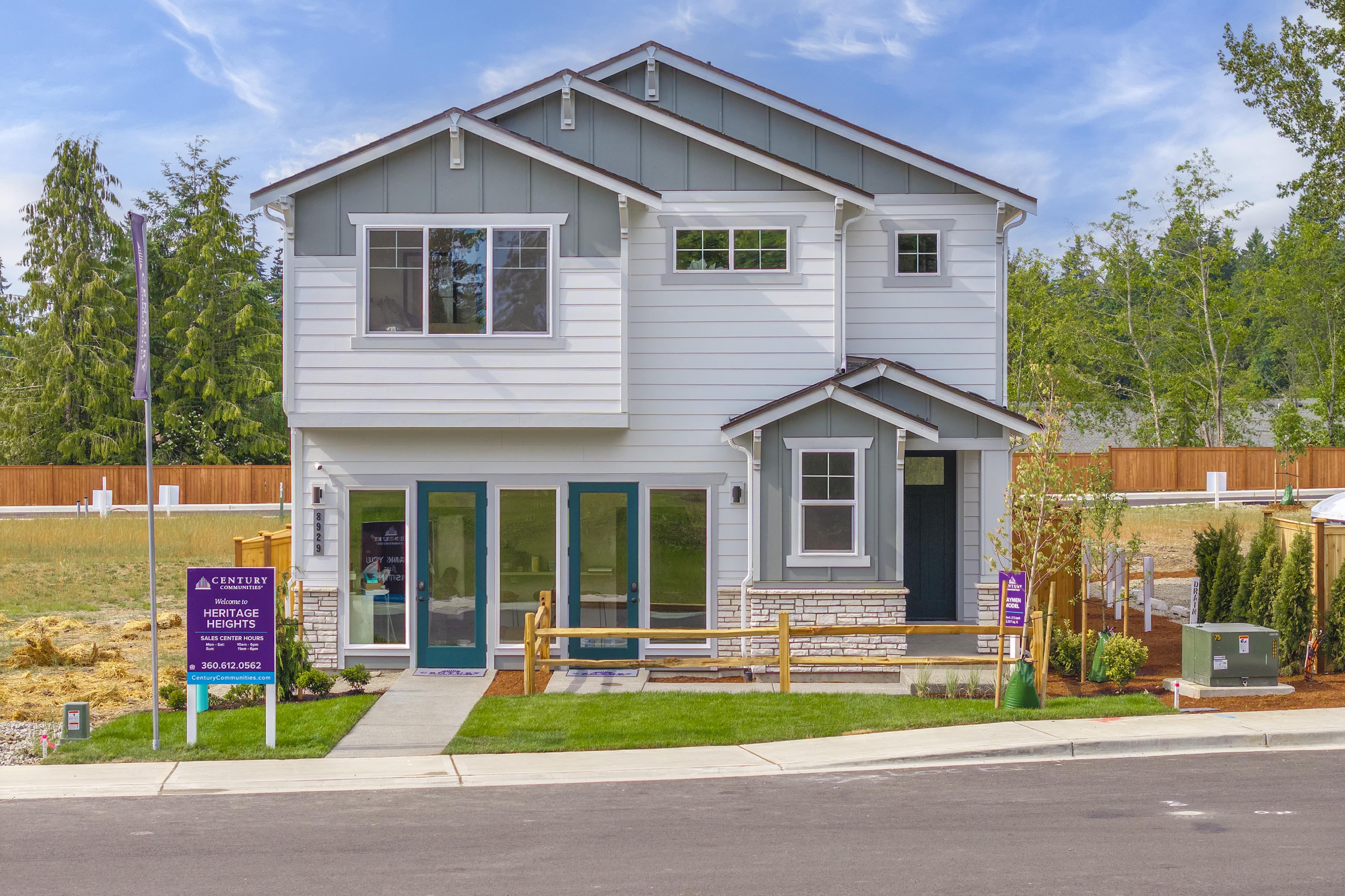 A white house with blue doors.