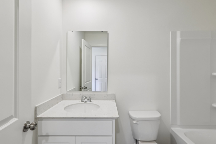 A bathroom with a sink and toilet.