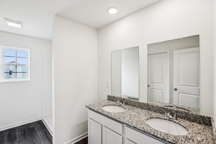 A bathroom with a marble countertop.