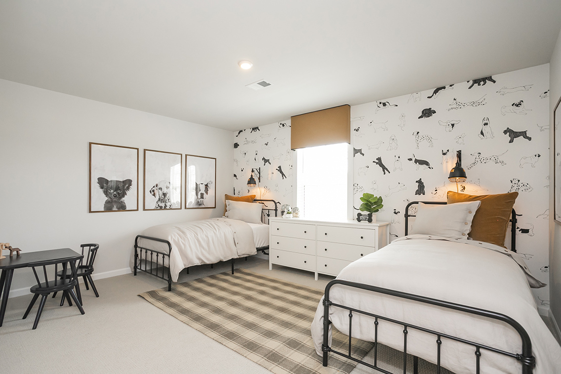 A bedroom with two beds.