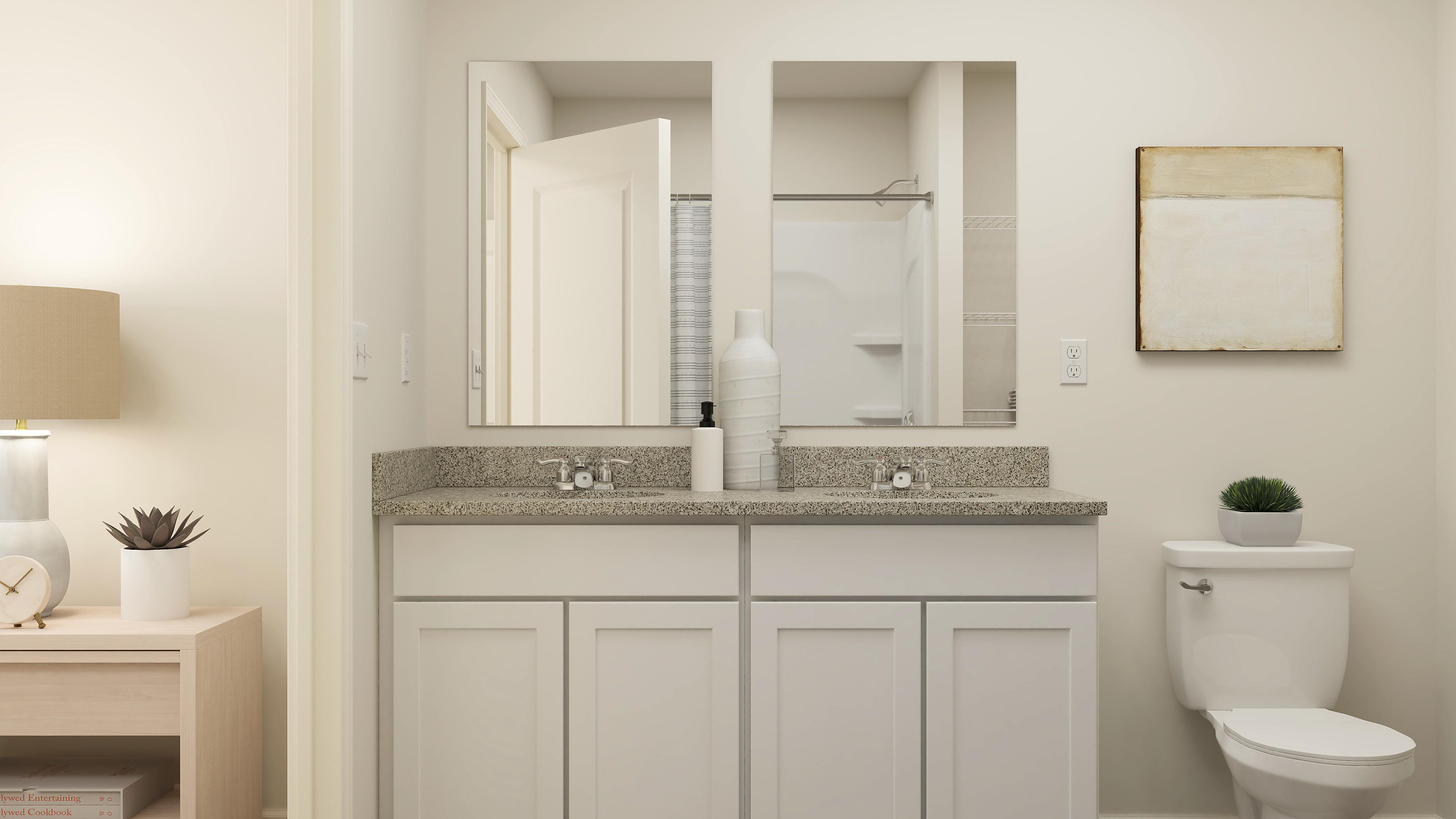 A bathroom with a sink and a toilet.