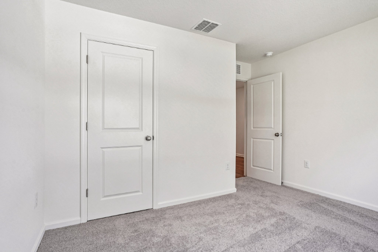 A room with white doors.