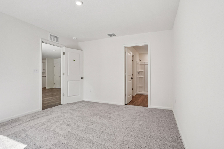 A hallway with white doors.