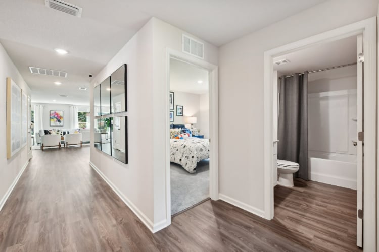 A bathroom with a large mirror.