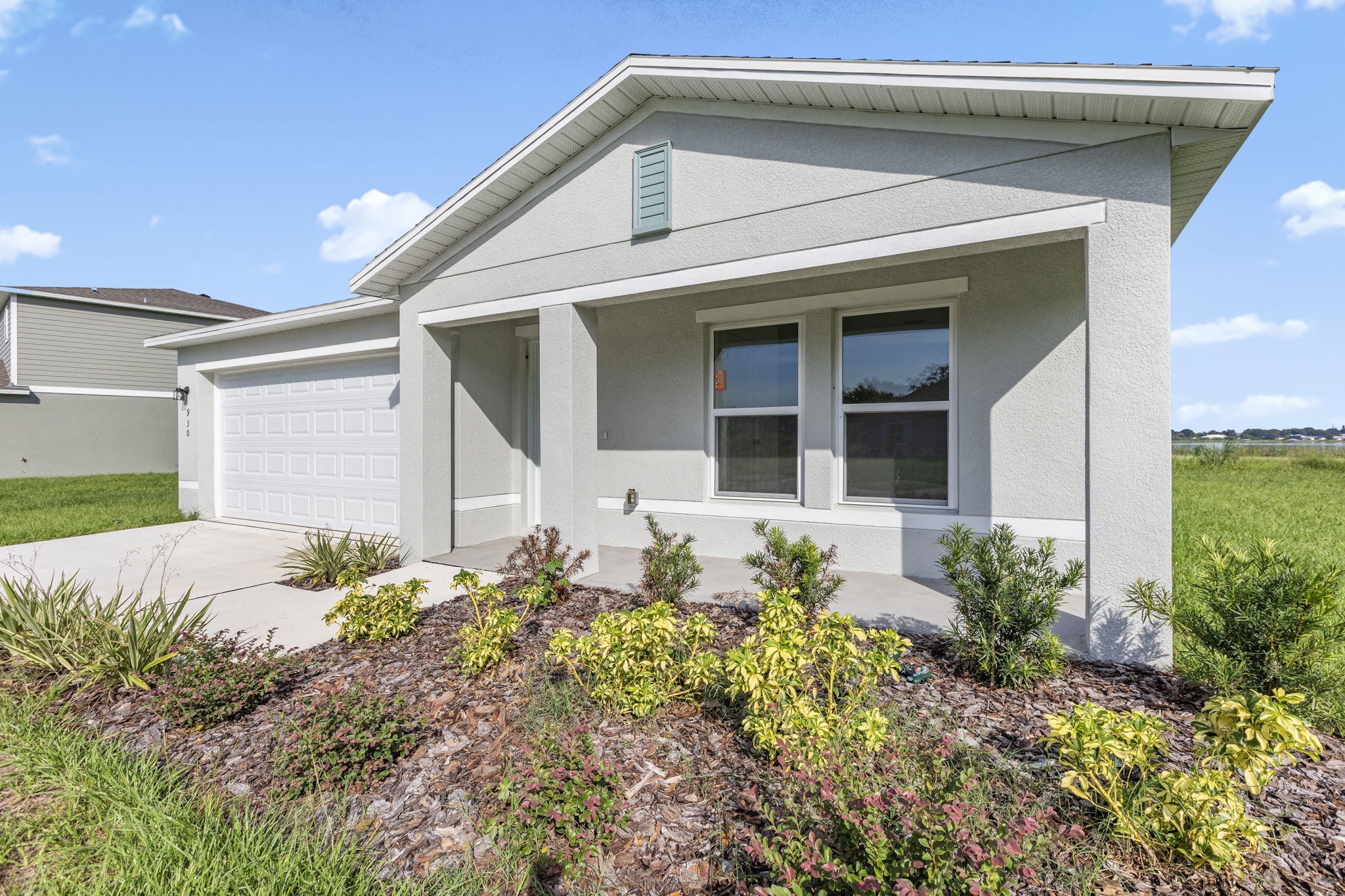 A house with a garden in front.