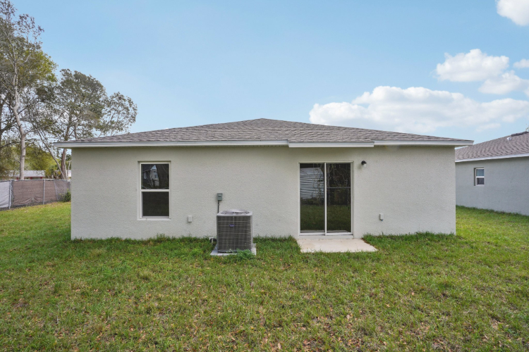 A white house with a fence.