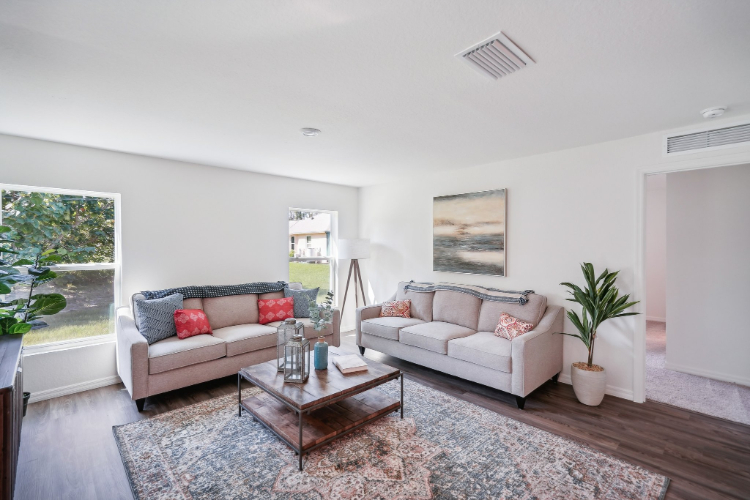 A living room with a couch and a coffee table.