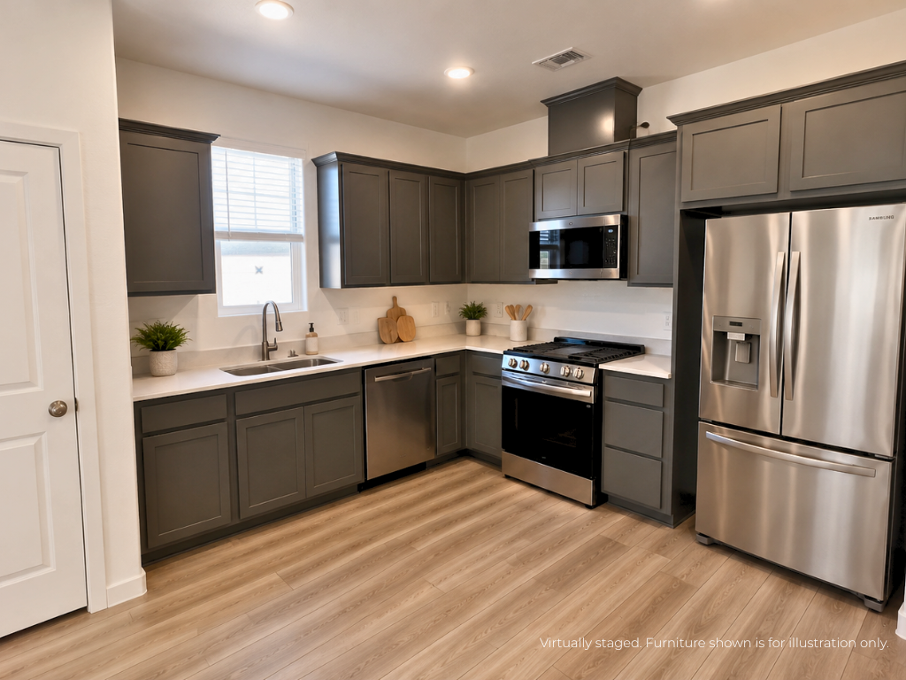 A kitchen with black cabinets.
